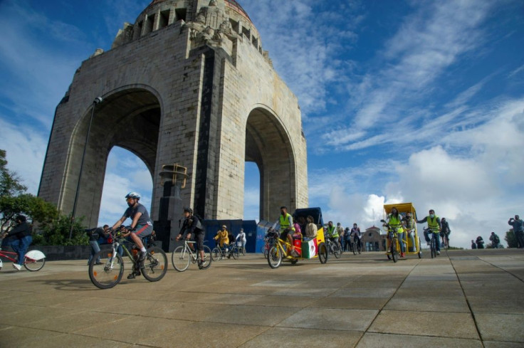 People take part in the bicycle ride 'Mexico las abraza' welcoming the young members from the Afghan robotics team who received asylum in Mexico City on September 19, 2021