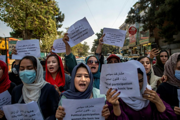 About a dozen Afghan women protested briefly Sunday outside the old Ministry for Women's Affairs, which has now been replaced by a department that earned notoriety for enforcing strict islamic doctrine