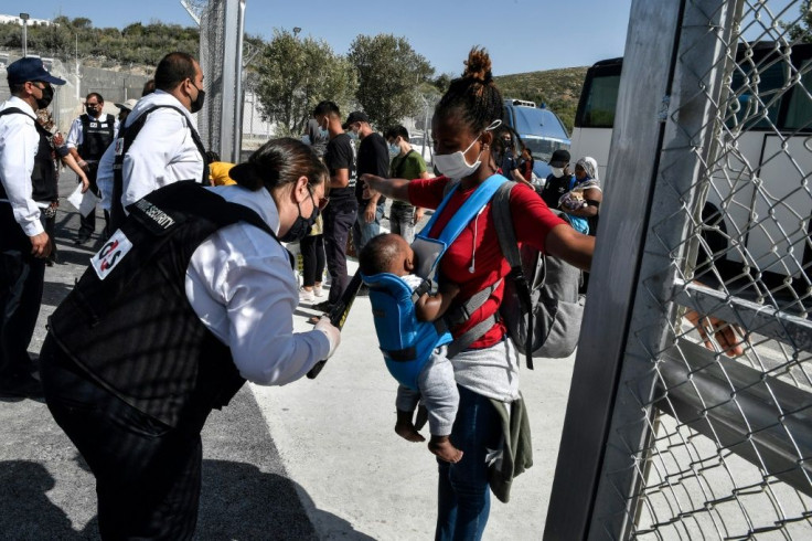 A double barbed-wire fence surrounds the camp on Samos island, a facility for 3,000 people that also has surveillance cameras, X-ray scanners and magnetic doors