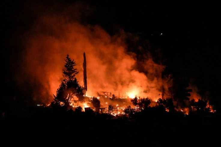 Late on Sunday, a fire broke out in an abandoned part of the Vathy camp -- though the ministry said nobody was hurt