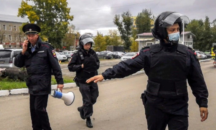 Police wearing helmets and body armour were deployed to the scene