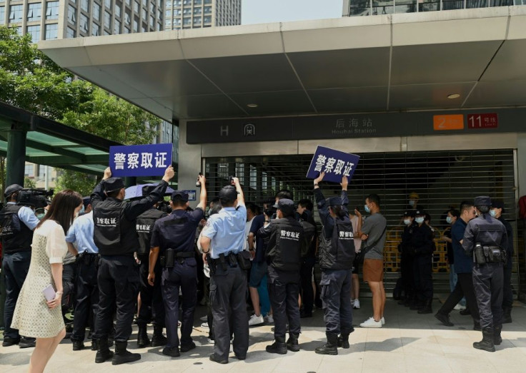 Once a symbol of its might, Evergrande's Shenzhen headquarters is now a besieged barometer of the wide swathe of potential collateral damage, with investors, suppliers and other partners holding daily vigil