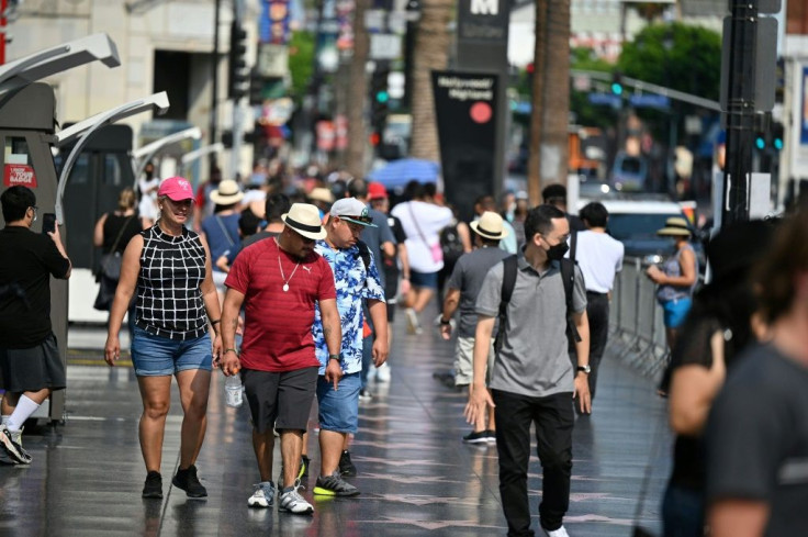 Tourists walk on Hollywood Boulevard's Walk of Fame