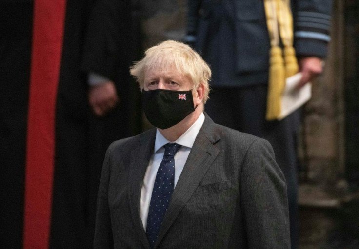 Britain's Prime Minister Boris Johnson wearing a protective face covering, attends a service of Thanksgiving and Rededication to commemorate the 81st Anniversary of the Battle of Britain at Westminster Abbey