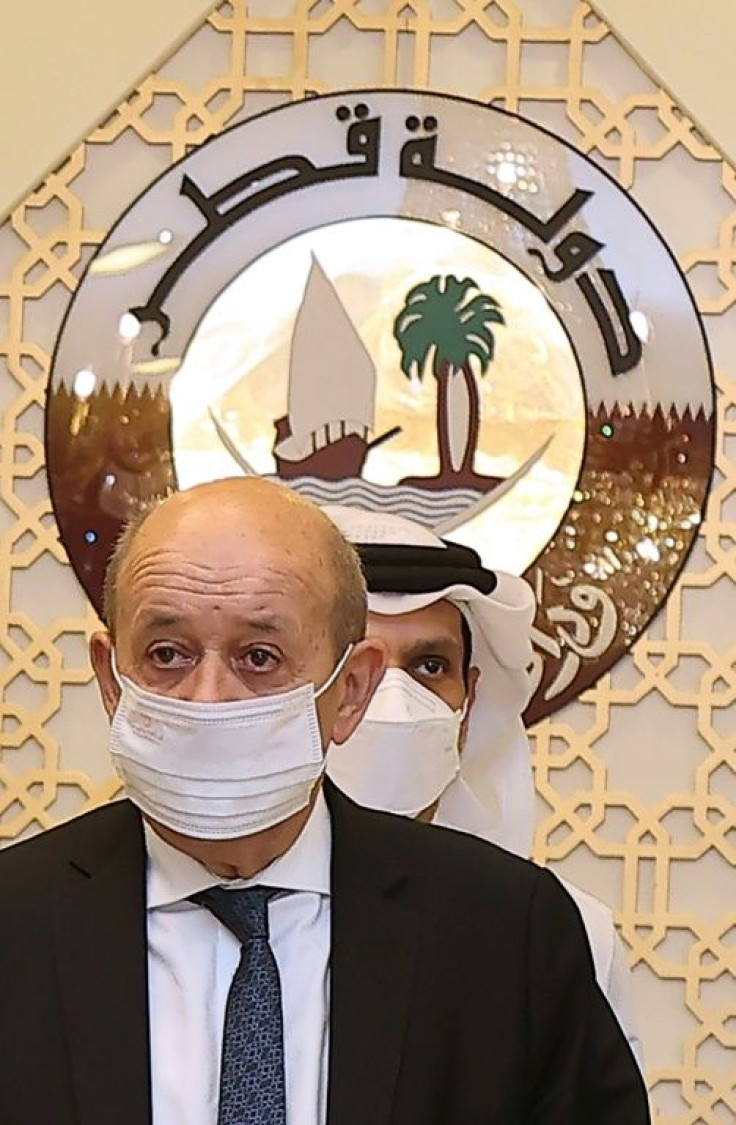 French Foreign Minister Jean-Yves Le Drian, seen on a September 2021 visit to Qatar, has no meeting scheduled with US Secretary of State Antony Blinken amid anger over a submarine deal