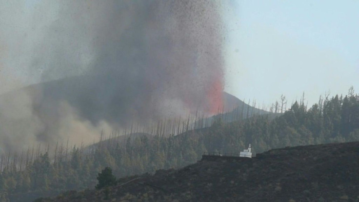 IMAGES The Cumbre Vieja volcano continues to send huge plumes of thick black smoke into the sky and lava after it erupted Sunday. Lava has destroyed homes and around 5,000 people have been evacuated from the area.