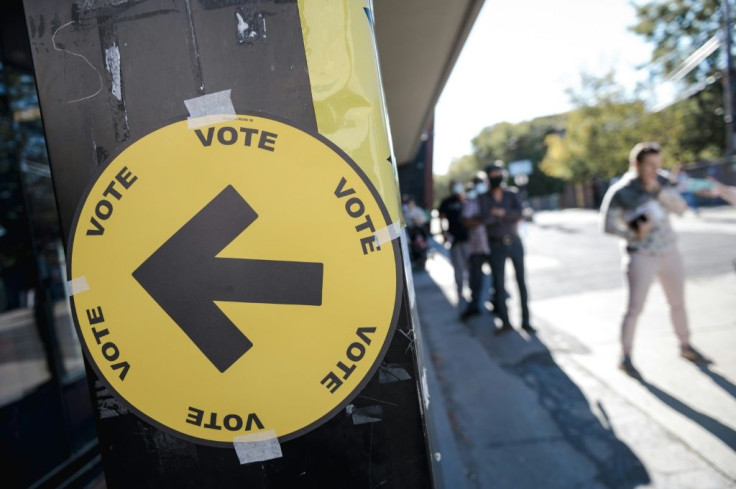 People line up at a Montreal polling station to vote in hotly-contested Canadian snap elections