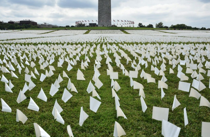 White flags are seen on the Mall in front of the Washington Monument in Washington to symbolize all those lost to Covid