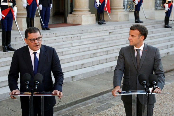 Libya's Interim Prime Minister Abdul Hamid Dbeibah (L) and French President Emmanuel Macron give a speech at the Elysee Palace in Paris, on June 1, 2021