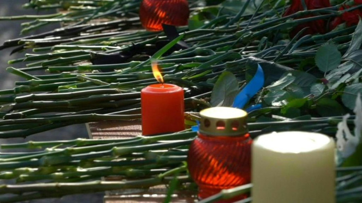 IMAGESIn central Russia, people lay flowers at the entrance of the Perm university campus, a day after a student went on a killing spree at this local university, killing six and wounding dozens.