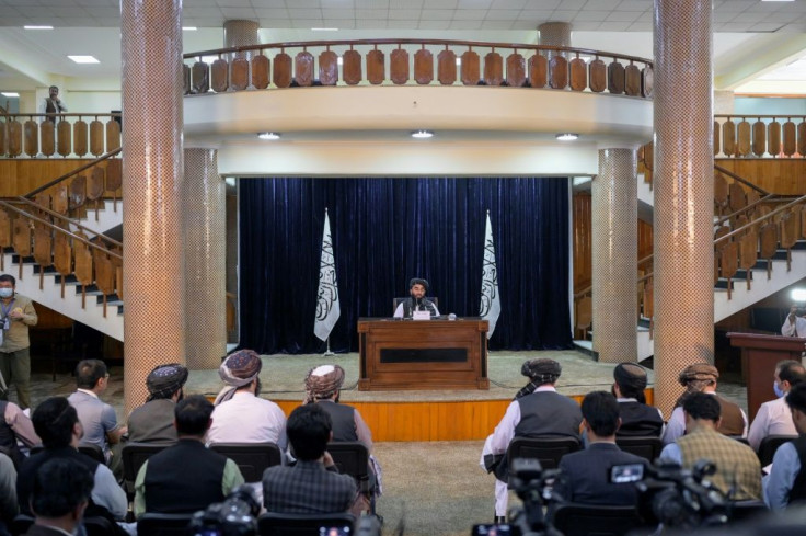 Zabihullah Mujahid, chief spokesman for the Taliban, announces the group's new appointment during a Kabul press conference