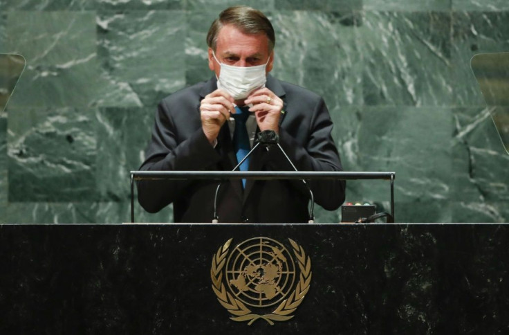 Brazil's President Jair Bolsonaro puts facemask back on after addressing the UN General Assembly on September 21, 2021