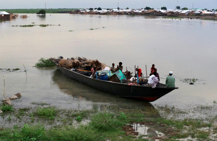 Heavy flooding has affected and displaced about 426,000 people in South Sudan, such as these pictured September 14, 2021, including 185,000 children, as overflowing rivers deluged homes and farms in the impoverished country