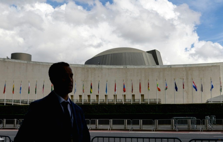 A man walks past the United Nations Headquarters during the 76th Session of the UN General Assembly