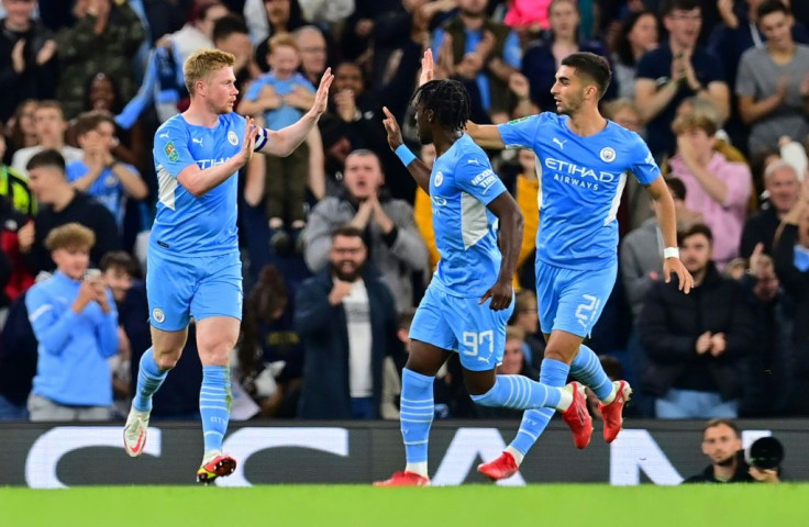 Manchester City midfielder Kevin De Bruyne (L) celebrates scoring against Wycombe