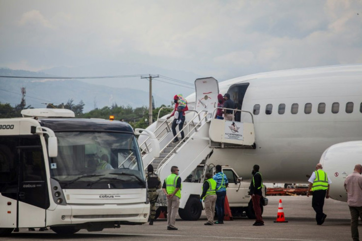 Deported Haitian migrants  arrive at the Port-au-Prince airport on September 19, 2021