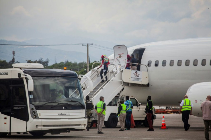 Deported Haitian migrants arrive at the Port-au-Prince airport on September 19, 2021