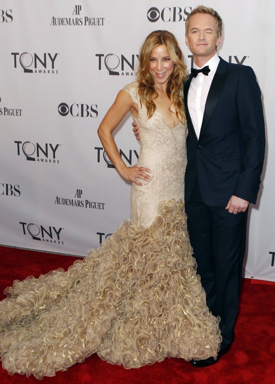 Host Harris arrives with an unidentified guest for the American Theatre Wings 65th annual Tony Awards ceremony in New York