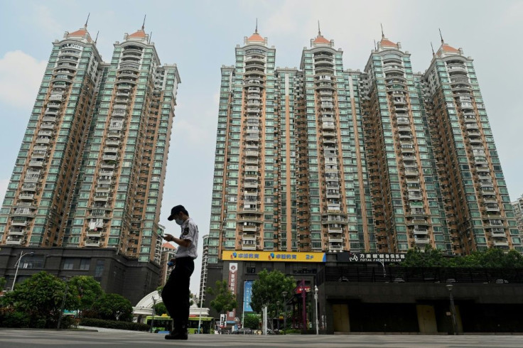 Chinese property developer Evergrande has admitted facing 'tremendous pressure' as it tackles a debt pile of more than $300 billion