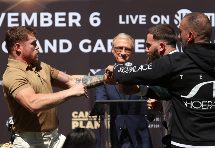 Canelo Alvarez slaps Caleb Plant during a face-off 