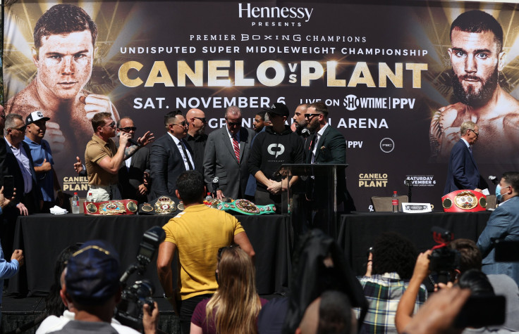 Canelo Alvarez speaks to Caleb Plant during a press conference ahead of their super middleweight fight on November 6