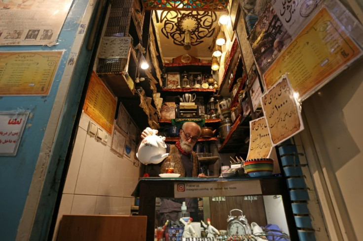 Kazem Mabhutian, 63, serves tea at the smallest and oldest teahouse tucked in an alleyway of the Grand Bazaar in the Iranian capital Tehran