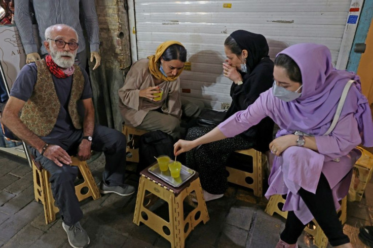 Given the miniature size of the teahouse, there are no tables, but customers can pull up a plastic stool outside, amid the bazaar's bustle