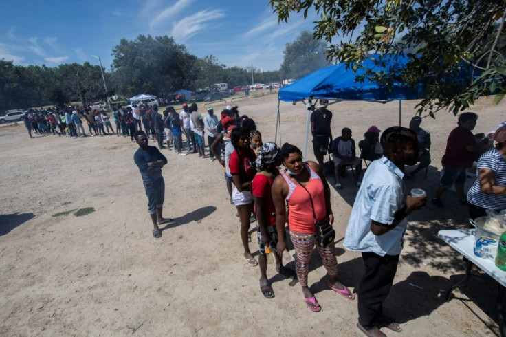 Haitian migrants queue for food in the Mexican city of Ciudad Acuna