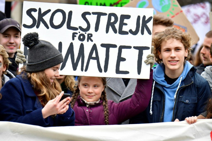 Jakob Blasel (R) in 2019, campaigning with Thunberg at a Fridays for Future demo in Berlin
