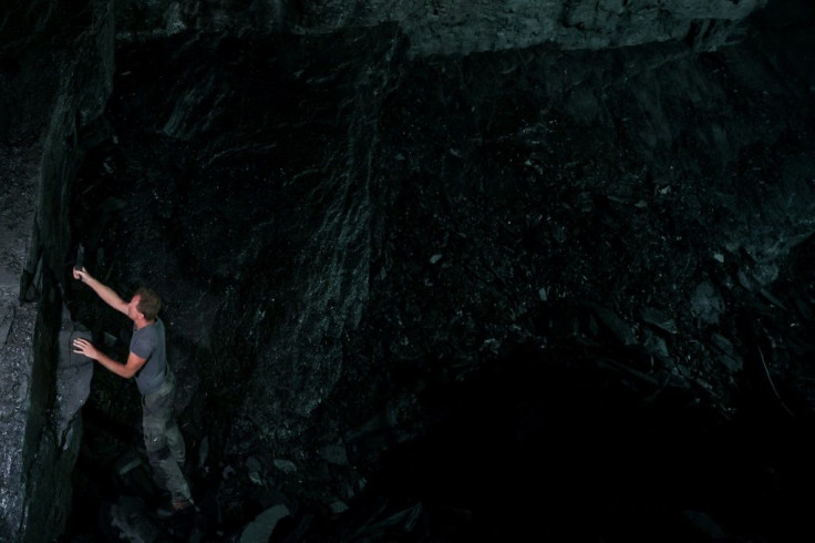 Theret works alone, in the bowels of the rock