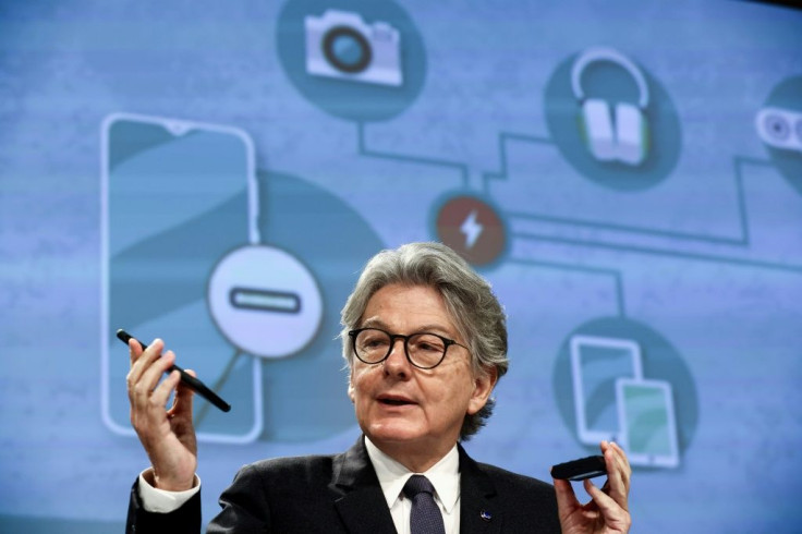 EU internal market commission Thierry Breton shows his phone as Brussels seeks to impose a universal charger