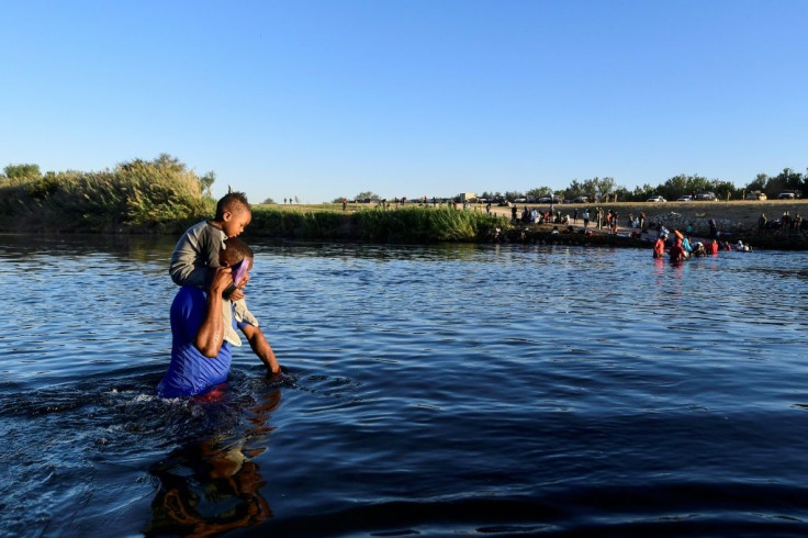 Haitian migrants cross the Rio Grande river from Ciudad Acuna, Mexico, to the United States.