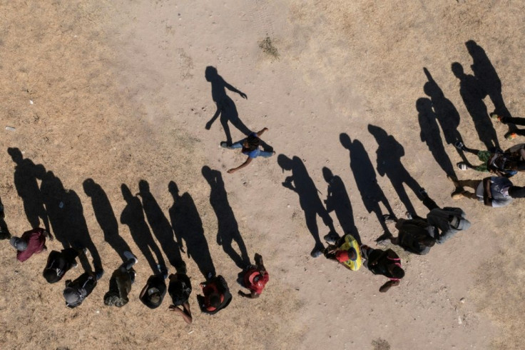 Haitian migrants queue for food in Ciudad Acuna in northern Mexico