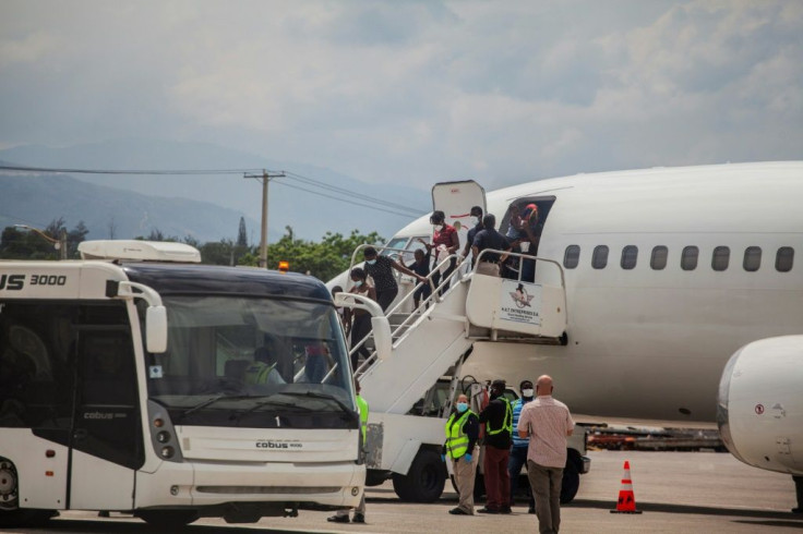 Haitians deported from the United States, some of them after harrowing months-long journeys, arrive at the airport in Port-au-Prince