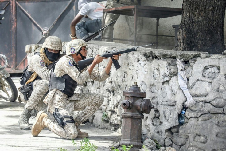 Haiti is under siege from armed gangs, which is why many seek to flee -- here, security forces battle armed men in Port-au-Prince