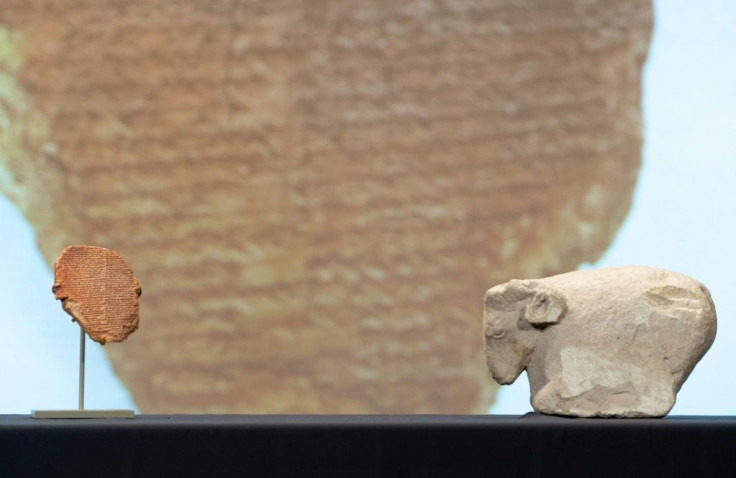 The tablet of Gilgamesh and a 5,000-year-old sculpture of a sheep are displayed September 23, 2021 in Washington, DC