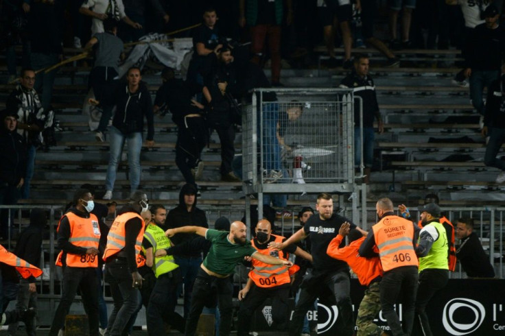 Marseille supporters clashed with opposing fans and security staff at Angers' stadium