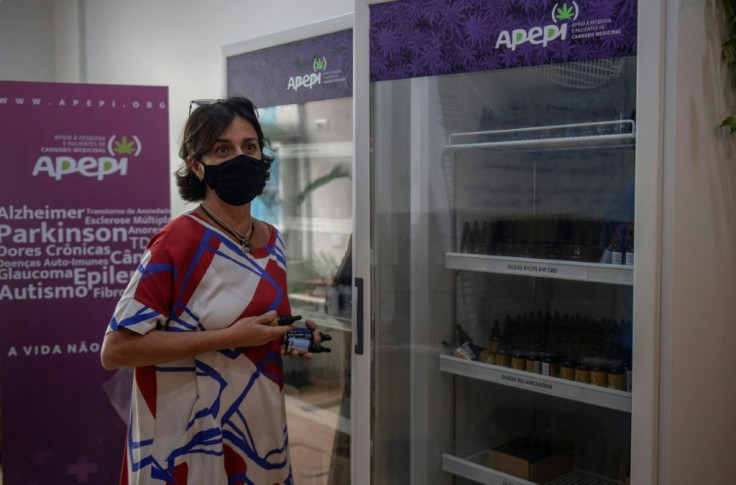 Brazilian lawyer and founder of the Medical Cannabis Research and Patient Support Association (Apepi) Margarete Brito shows a fridge containing medicinal cannabis oil at Apepi headquarters