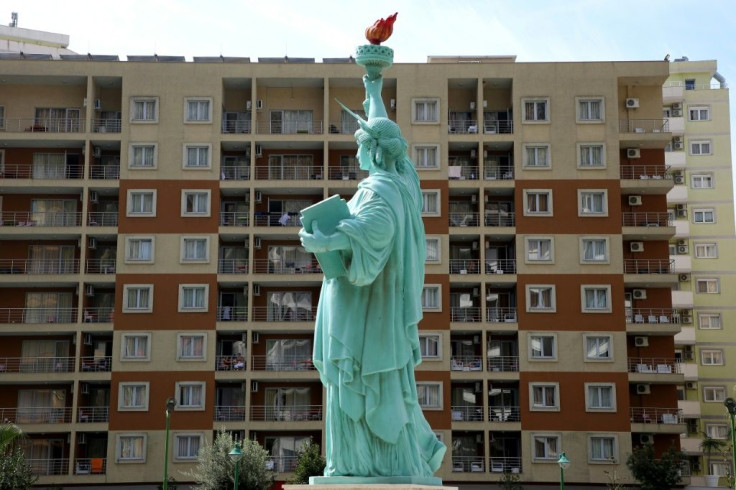 The exiles living at the expense of US NGOs and the Albanian government -- in a hotel featuring a replica of the Statue of Liberty