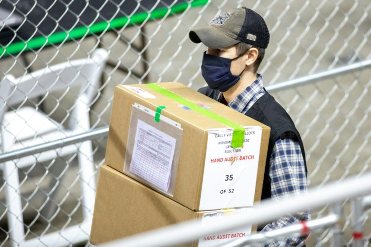 A contractor working for Cyber Ninjas transports ballots from the 2020 general election