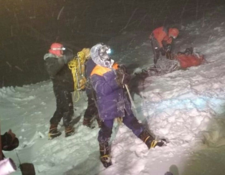 A Russian Emergencies Ministry photo shows rescuers on Mount Elbrus after a group of climbers was struck by severe weather conditions while at an altitude of over 5,000 metres (16,000 feet)