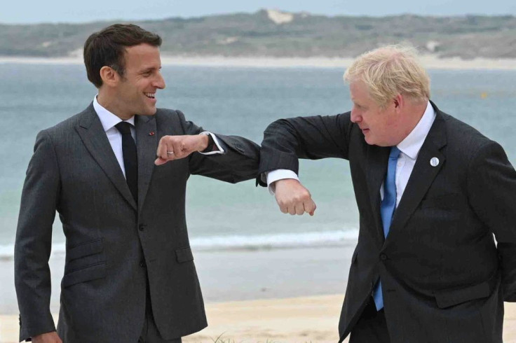 British PM Boris Johnson (R) said he hoped for cooperation with France