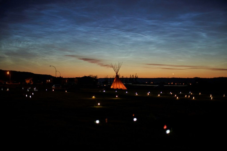 Solar lights and flags mark where 751 human remains were discovered in unmarked graves at the site of the former Marieval Indian Residential School in Saskatchewan, Canada in June 2021