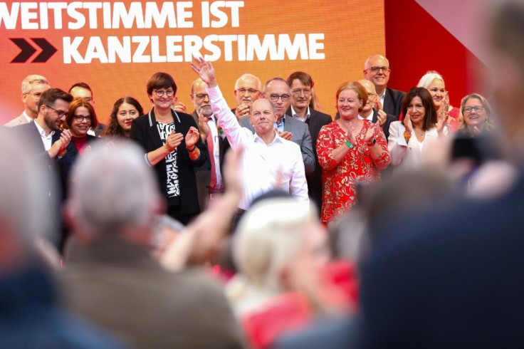 Finance Minister and the Social Democratic Party's candidate, Olaf Scholz, (C) has sold himself as the 'continuity candiate'