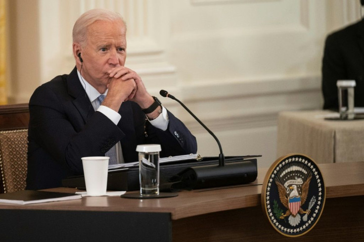 US President Joe Biden listens as India Prime Minister Narendra Modi speaks with Japan Prime Minister Yoshihide Suga and Australian Primer Minister Scott Morrison during the first-ever in-person Quad summit at the White House