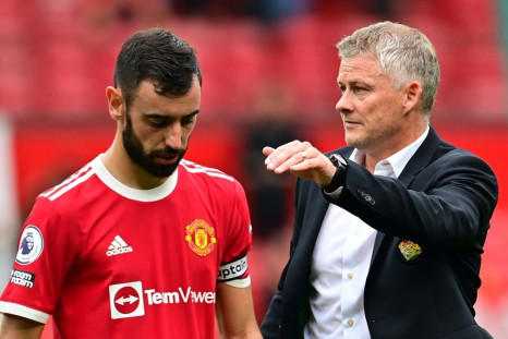 Manchester United boss Ole Gunnar Solskjaer consoles Bruno Fernandes after he missed a penalty in United's 1-0 defeat by Aston Villa