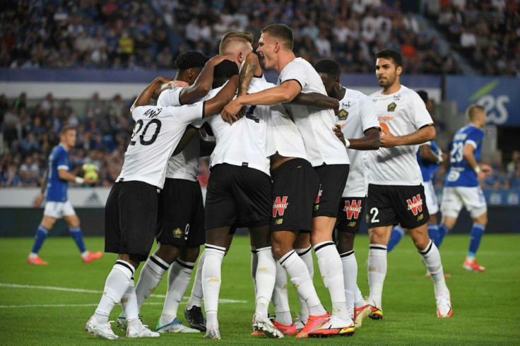 Lille players celebrate after Jonathan David put them ahead against Strasbourg