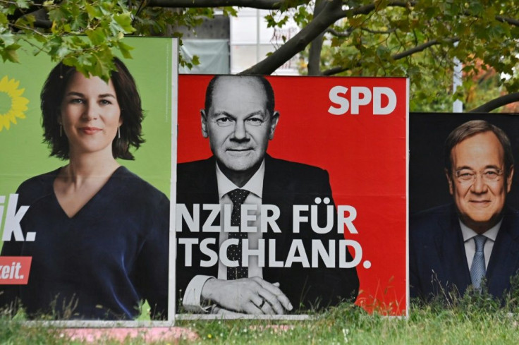 Billboards with election campaign posters showing the three chancellor candidates in the the September 26 federal election
