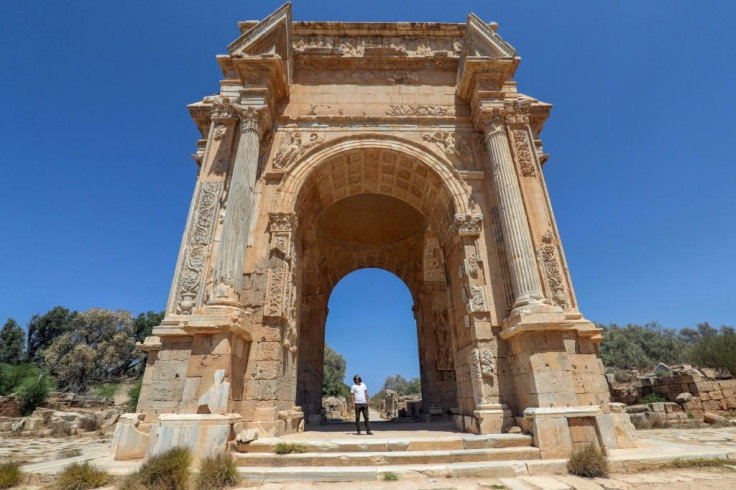 One of the few visitors to the ancient Roman city of Leptis Magna in Libya looks at the Arch of Septimius Severus