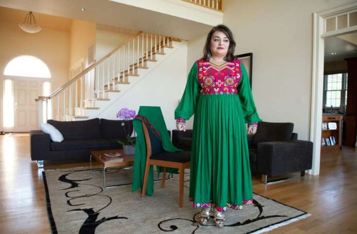 Bahar Jalali, an Afghan-American academic, wears an Afghan traditional dress in her home in Glenwood, Maryland, September 24, 2021